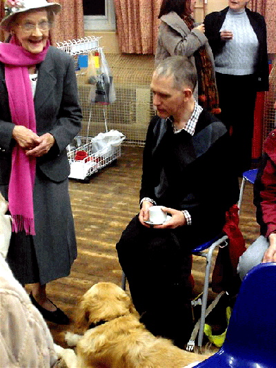 Image: David Liddle and dog, with a church member.