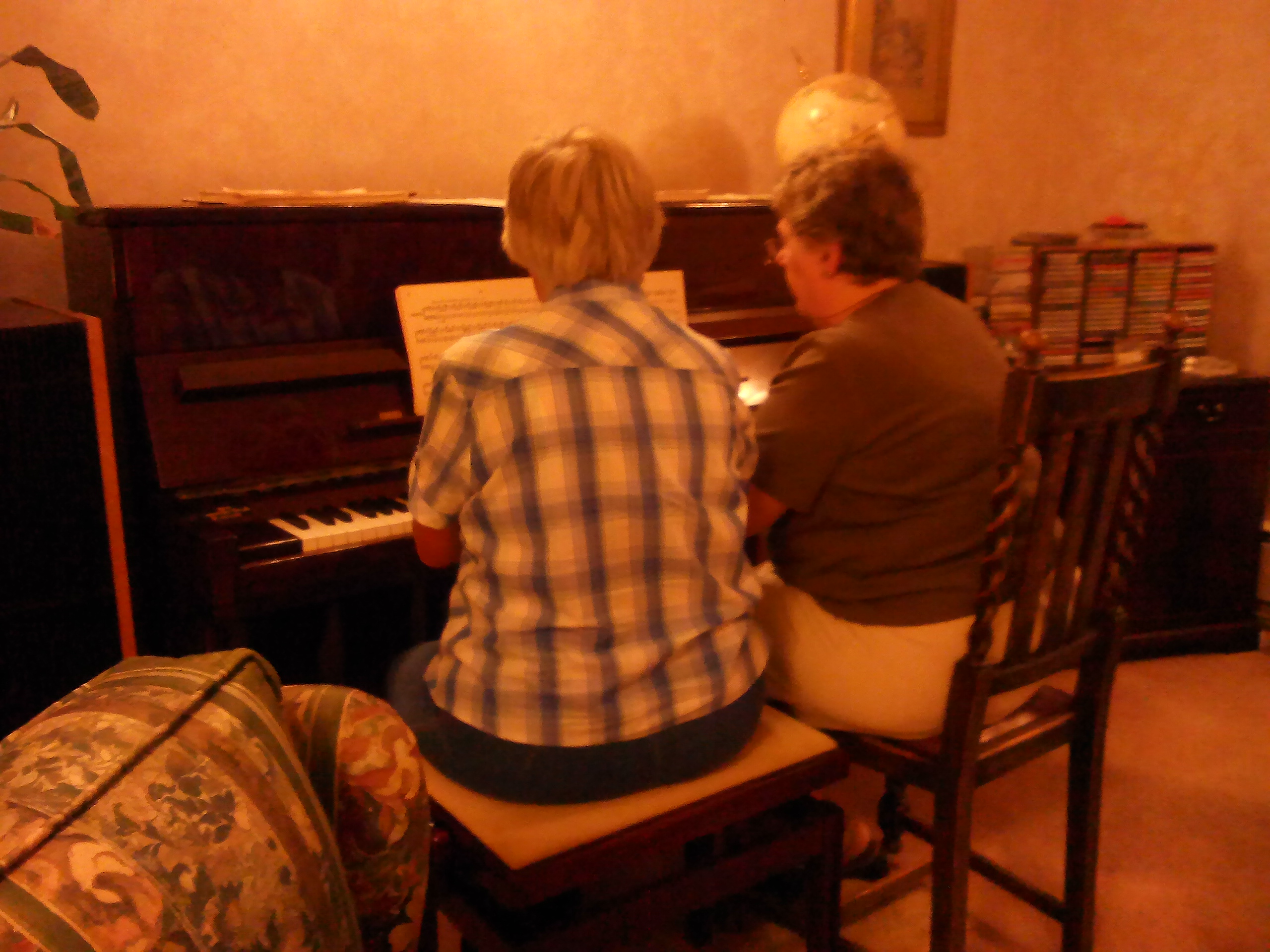 Image: Hilary and Mary playing the piano