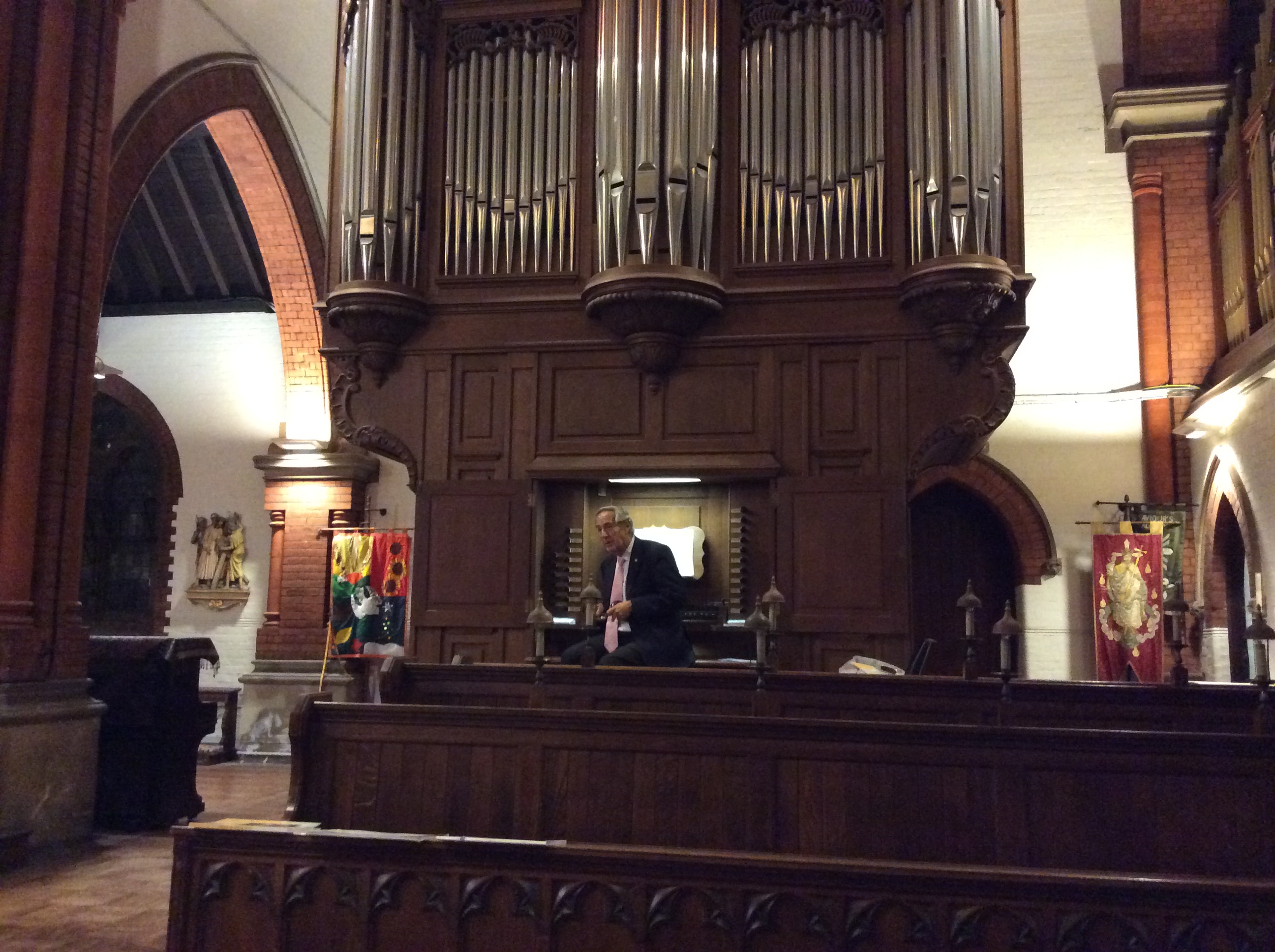 Image: Dr Peter Stokes at the organ